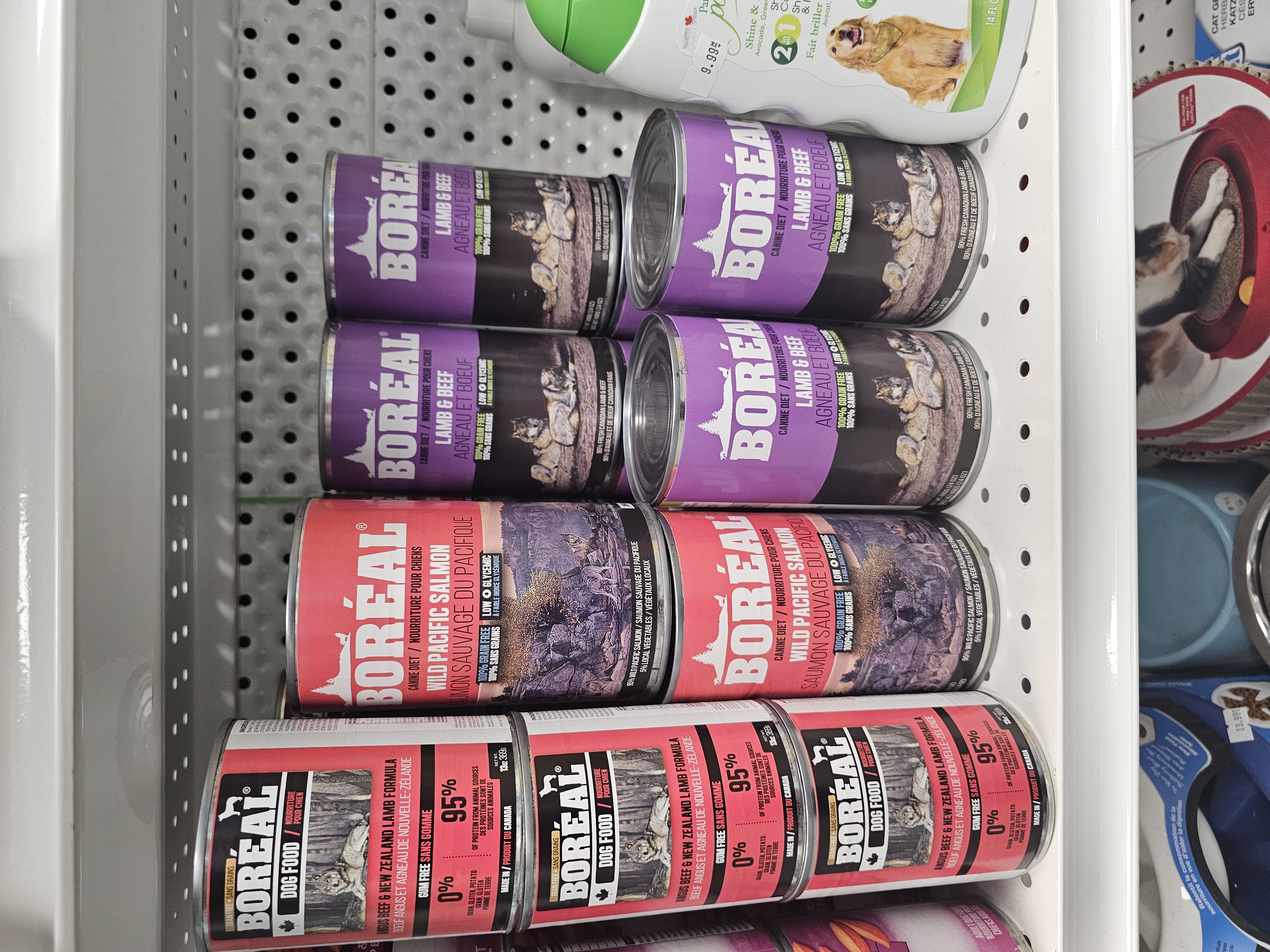 Boreal canned pet food stacked on store shelves